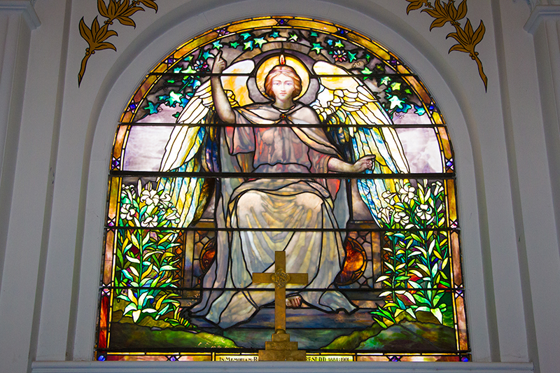 The stain glass window on the alter of the Reformed Church in the historic Port Richmond section of Staten Island, N,Y. on Friday Oct. 25, 2013. The glass may have been made by Louis Comfort Tiffany, but is unsigned and authentication would cost $1500.00. (Gordon Donovan)
