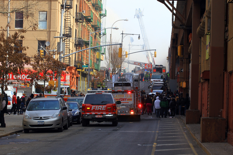 Emergency vehicles block the streets after two buildings collapsed following an explosion on Park Ave. and 116th Street in New York City, March 12, 2014. (Gordon Donovan/Yahoo News)