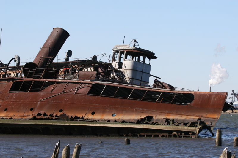 Two old ferries sit rusting in the cold, polluted waters in between New Jersey and Staten Island. (Gordon Donovan)