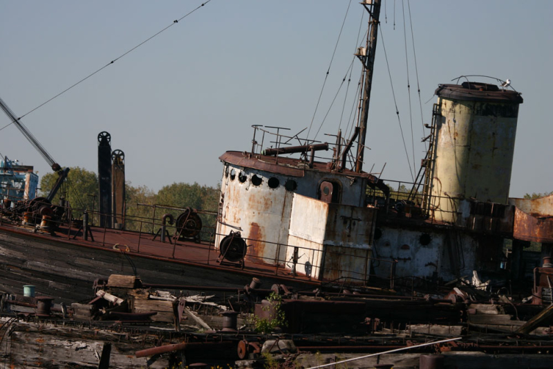Several retired vessels wait to be scrapped in a junkyard in the Rossville section of Staten Island. (Gordon Donovan)