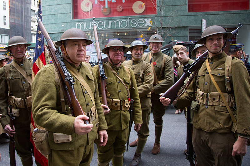 People dressed as doughboys (WWI infantrymen) get ready for the Veterans Day parade on Fifth Avenue in New York on Nov. 11, 2014. The Dough Boys are members of several armed forces who were wearing World War II uniforms to honor the 100th anniversary of the start of the war. (Gordon Donovan) 