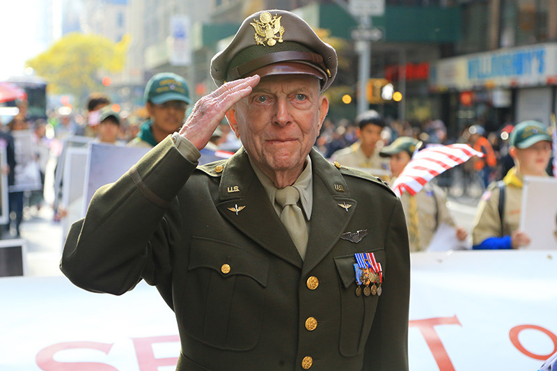 Veteran Jerry Yellin salutes as he leads the "The Spirit of 45" during the Veterans Day parade up Fifth Avenue in New York on Nov. 11, 2014. (Gordon Donovan)