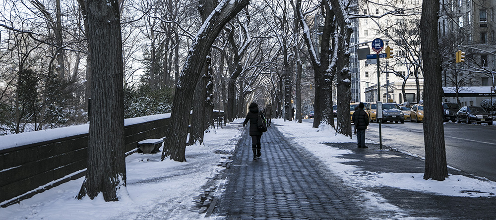 A woman walks up 5th Ave. along Central Park after a winter storm hit the New York City area, Friday Jan. 9, 2015. (Gordon Donovan/Yahoo News)