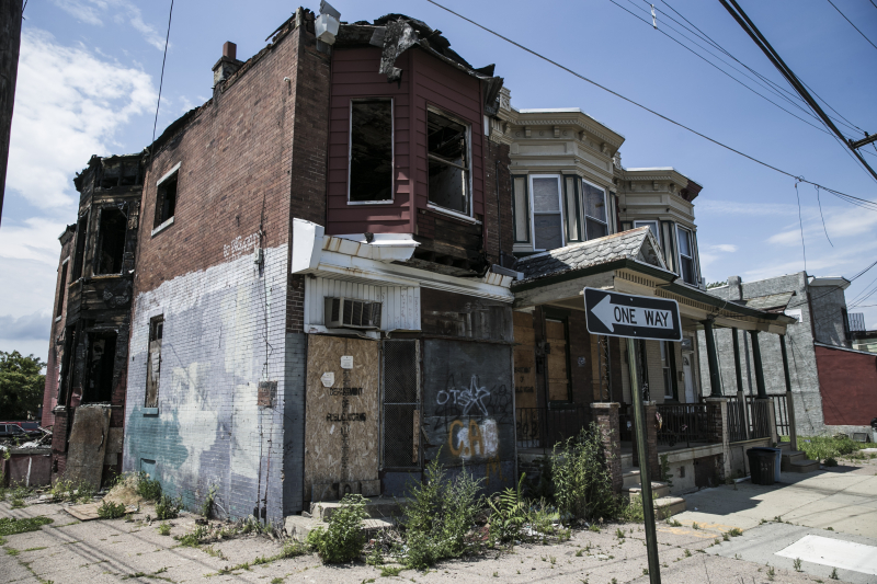 A boarded up vacant that fell victim to a fire that awaits demolition in Camden N.J. (Gordon Donovan)