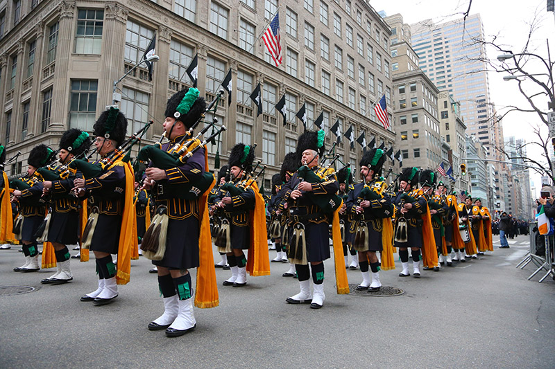 Members of the New York City Police Department Emerald Society march in the St. Patrick's Day parade past protesters, March 17, 2015, in New York. (Gordon Donovan)