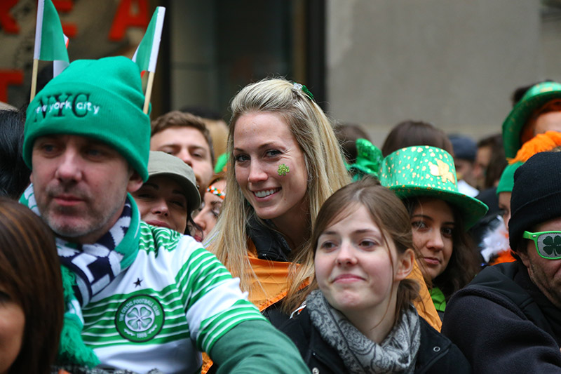 A young woman showing her Irish hertitage with a shamrocks on her cheek enjoys the St. Patrick's Day Parade, March 17, 2015, in New York. (Gordon Donovan)