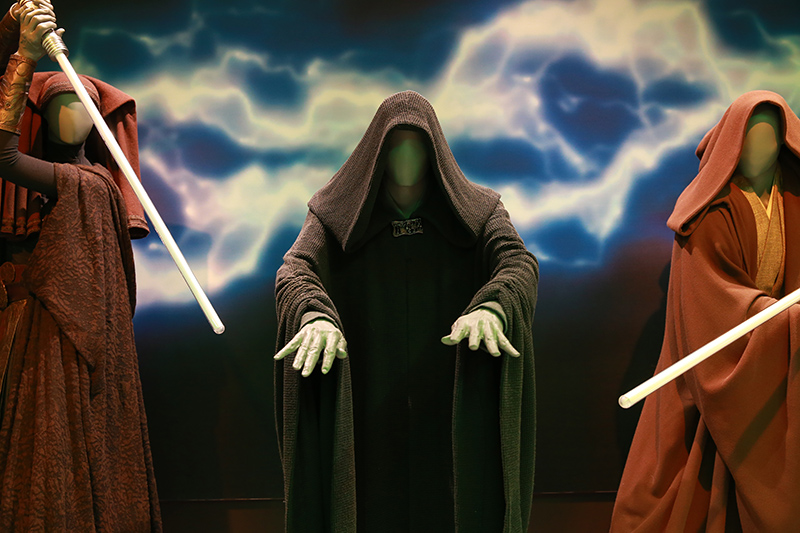Darth Sidious, the evil Dark Lord of the Sith who becomes Emperor of the Galactic Empire, wears the instantly recognizable black-hooded shape that was established in the first trilogy. For the prequels, actor Ian McDiarmid used the original neck brooch, which had been carefully stored in the archives. Darth Sidious's costume barely changes or develops throughout the saga. It was remade for "The Phantom Menace" in a very similar cloth and pattern. (Gordon Donovan/Yahoo News)