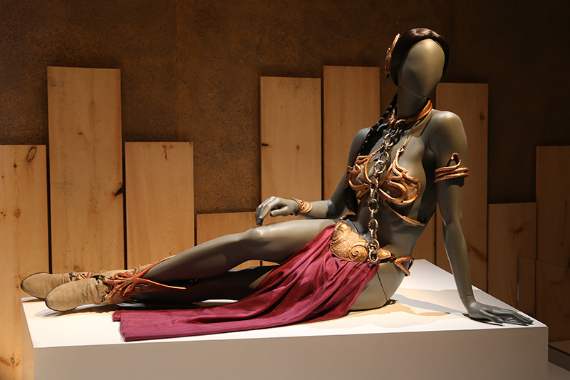 Costume designers Nilo Rodis-Jamero and Aggie Rodgers designed the slave bikini, but struggled with how to dress the normally modest Leia with such boldness. Inspired by fantasy artist Frank Frazetta, they designed a costume in collaboration with sculptor Richard Miller. They created multiple versions of the costume to accommodate different scenes in the film, including a hard metal piece for scenes in which Fisher remained still, and a rubber costume she and stuntwoman Tracy Eddon could wear comfortably while performing stunts. (Gordon Donovan/Yahoo News)