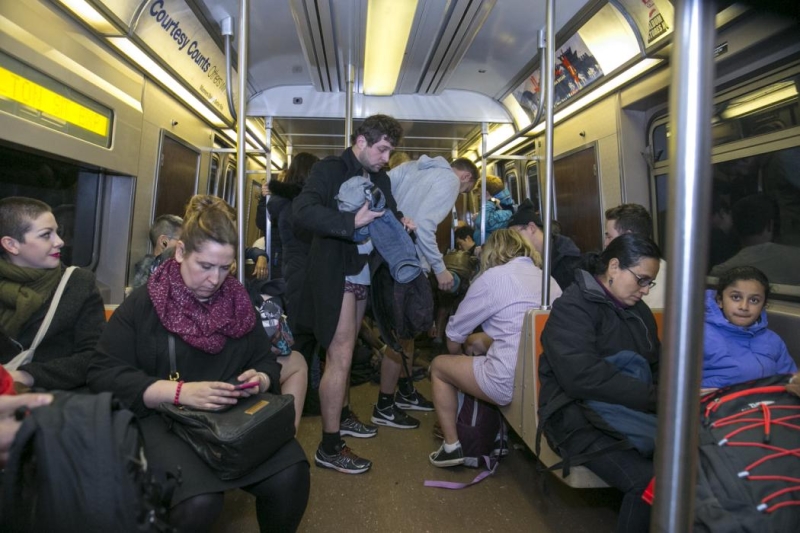New York City: Participants of the No Pants Subway Ride remove their pants as onlookers watch on the subway in New York City, Sunday, Jan. 10, 2016. (Gordon Donovan/Yahoo News)