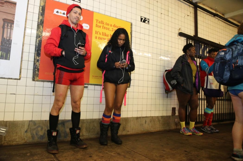 Passengers wait for the subway as they take part in the No Pants Subway Ride in New York City, Sunday, Jan. 10, 2016. The No Pants Subway Ride began in 2002 in New York as a stunt and has taken place in cities around the world since then. (Gordon Donovan/Yahoo News)