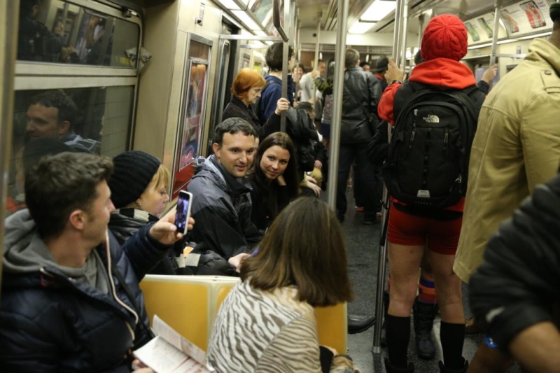 A passenger on the subway takes a photo of people participating in the No Pants Subway Ride in New York City, Sunday, Jan. 10, 2016. (Gordon Donovan/Yahoo News)