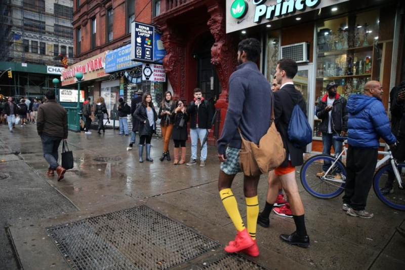 Bystanders take photos as participants of the No Pants Subway Ride take it to the streets as they head towards Union Square in New York City, Sunday, Jan. 10, 2016. (Gordon Donovan/Yahoo News)