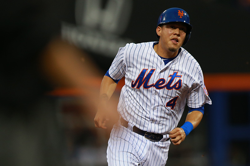 New York Mets Wilmer Flores (4) moves to 3B in the fourth inning of a baseball game against the Colorado Rockies at Citi Field in New York, Tuesday, Aug. 11, 2015. (Gordon Donovan)
