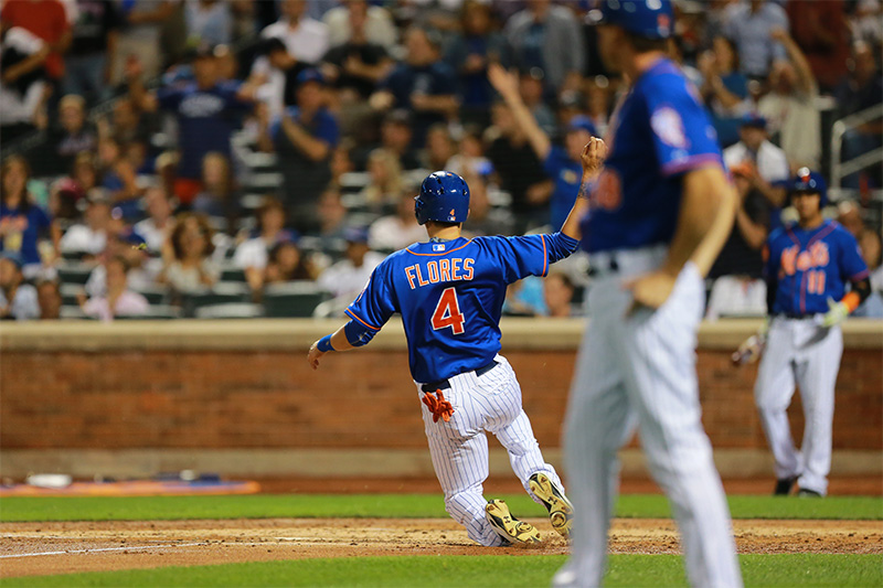 New York Mets Wilmer Flores (4) scores in the second inning of a baseball game against the Boston Red Sox at Citi Field in New York, Friday, Aug. 28, 2015. (Gordon Donovan)