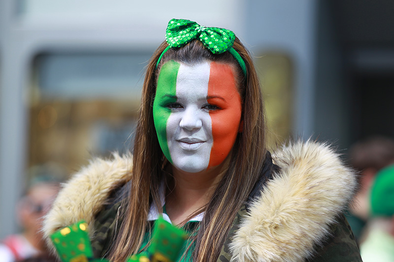 A young woman with her face painted in the colors of the flag of Ireland watches the St. Patrick's Day Parade on March 17, 2016, in New York. (Gordon Donovan/Yahoo News)