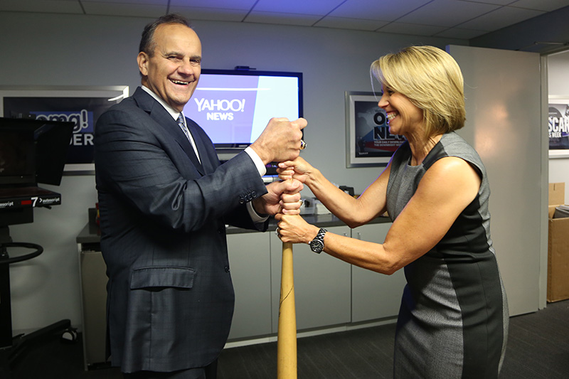 Katie Couric takes on Hall of Fame Yankees Manager Joe Torre to choose sides with an official Yahoo bat at the Yahoo News Studios in New York City, Thursday, Sept. 25, 2014. (Yahoo News/Gordon Donovan)