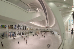 People walk through the Oculus mall at World Trade Center on Wednesday, August 17, 2016. It stretches along a four-block underground network that spans the bases of three office towers. While mostly below street level, light beams in through the windows of the winged Oculus, designed by Santiago Calatrava, that top the transportation hub of 13 subway trains and river ferries. (Gordon Donovan/Yahoo News)