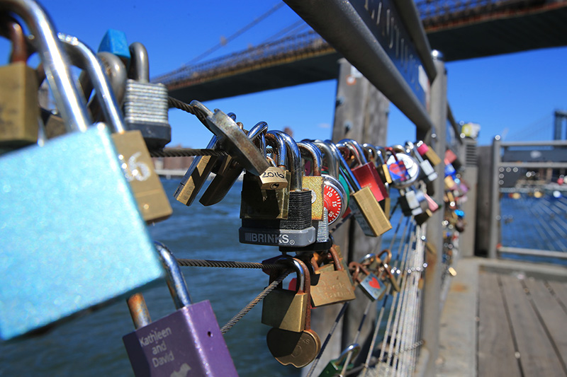 A view of love padlocks attached on the railings of Pier 1 next to the Brooklyn Bridge on August 23, 2016. (Gordon Donovan/Yahoo News)
