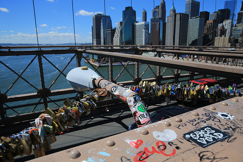 Love padlocks attached to light posts on the Brooklyn Bridge on August 23, 2016. (Gordon Donovan/Yahoo News)
