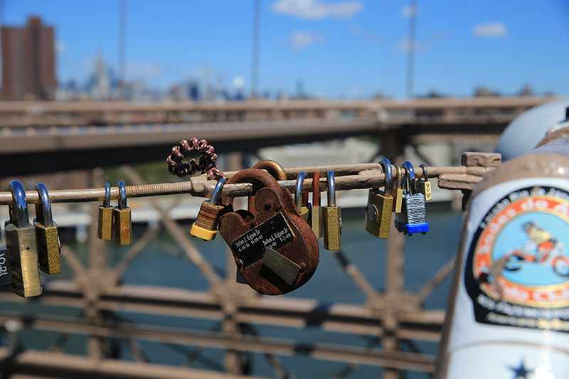 An older style lock hangs on a light post on the Brooklyn Bridge on August 23, 2016. (Gordon Donovan/Yahoo News)