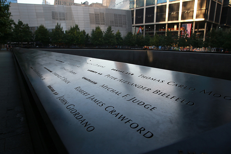 The panels with the names of victims from the September 11, 2001 attacks are reflected by the morning light on Sept. 8, 2016.(Gordon Donovan/Yahoo News)