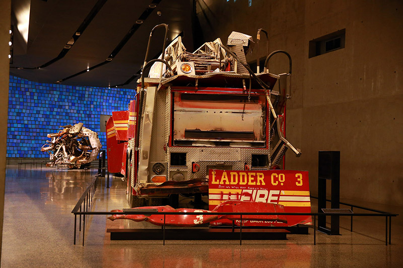 The rear mount aerial truck was parked on West Street near Vesey Street. When the North Tower collapsed, the truck was damaged beyond repair, with its entire front cab destroyed. A bumper and back door panel were later removed from the rig and placed on display as a memorial in Ladder Company 3’s quarters on East 13th Street in Manhattan. The inscription "Jeff We Will Not Forget You!" was painted on the panel by a firefighter related to Jeffrey John Giordano, one of the 11 Ladder Company 3 members who perished that day. (Photo: Gordon Donovan/Yahoo News)