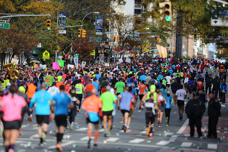 A pack of runners reach First Ave. just past mile 16 of the 2016 New York City Marathon, Nov. 6, 2016. (Gordon Donovan/Yahoo News)