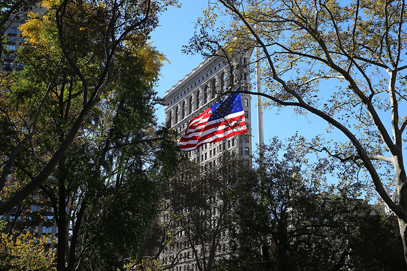 A U.S. flag flies over Madison Square Park during a ceremony honoring veterans in New York City on Nov. 11, 2016. (Gordon Donovan)