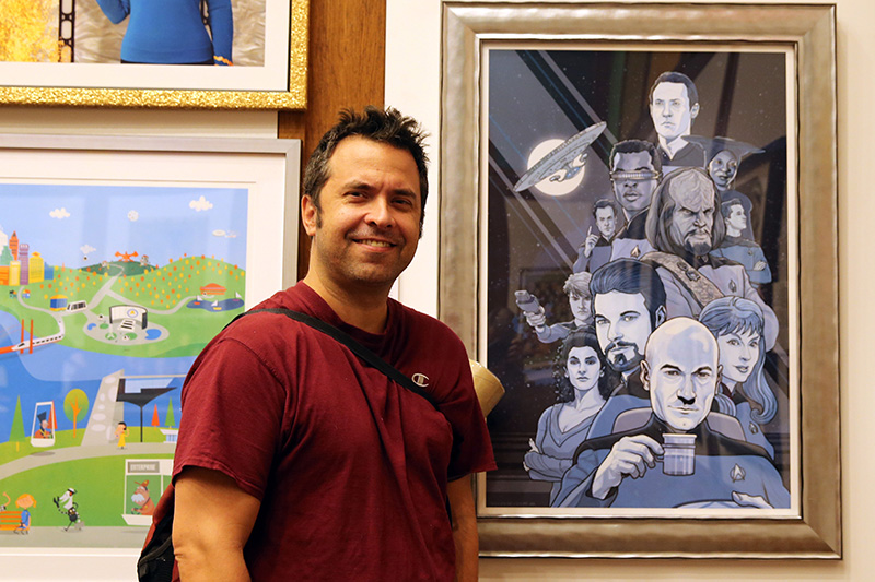 PJ McQuade stands next to his work "Boldly Going" at the "Star Trek: 50 Artists. 50 Years." exhibit at the Paley Center, on display Sept. 16-25, 2016. McQuade's work has appeared in the Hollywood Reporter, CBS, Variety, AMC, MTV, Toronto Life and ESPN. (Photo: Gordon Donovan/Yahoo News)