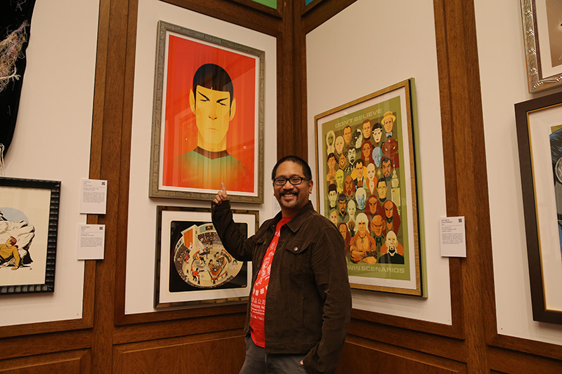 Stanley Chow gestures towards his work "Teleportation of Mr. Spock." Chow is an illustrator, artist and graphic designer who hails fom the North of England. He is known for his portraits, particulary of pop-culture figures, and his clients include Saatchi and Saatchi and McDonald's. (Photo: Gordon Donovan/Yahoo News)