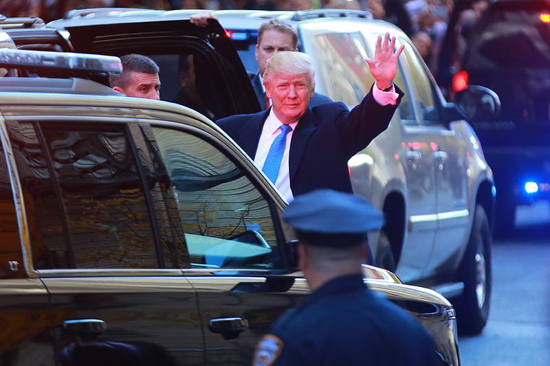 Republican presidential candidate Donald Trump arrives with the Secret Service to cast his ballot at PS-59 in New York City on Tuesday, Nov. 8, 2016. (Gordon Donovan/Yahoo News)