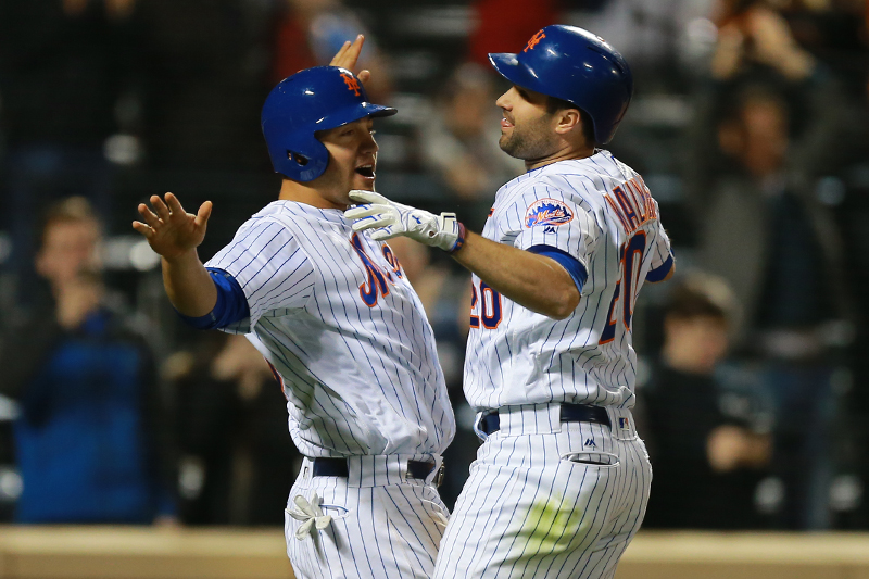 New York Mets Neil Walker (20) is congratulated after homering in the eighth inning of a baseball game against the Cincinnati Reds at Citi Field in New York, Monday, April 25, 2016. (Gordon Donovan)