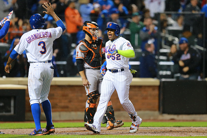 New York Mets Yoenis Cespedes (52) celebrates after hitting a grand slam in the third inning of a baseball game against the San Francisco Giants at Citi Field in New York, Friday, April 29, 2016. (Gordon Donovan)
