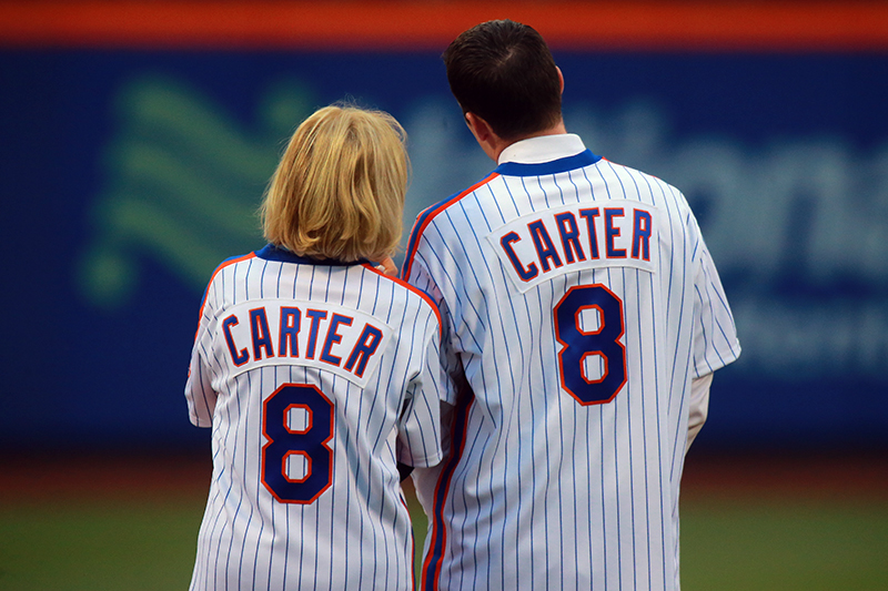 The wife and son of former 1986 New York Mets catcher Gary Carter stand on the field during a ceremony honoring the 1986 World Champions at Citi Field in New York, Saturday, May 28, 2016. (Gordon Donovan)