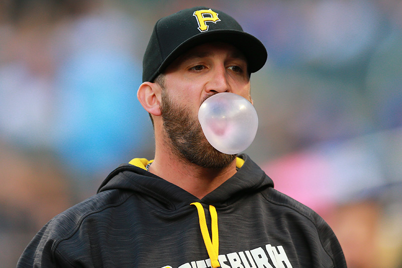 Pittsburgh Pirates pitcher Jon Niese blows a bubble as he heads to the dugout before the baseball game against the New York Mets at Citi Field in New York, Thursday, June 16, 2016. (Gordon Donovan)