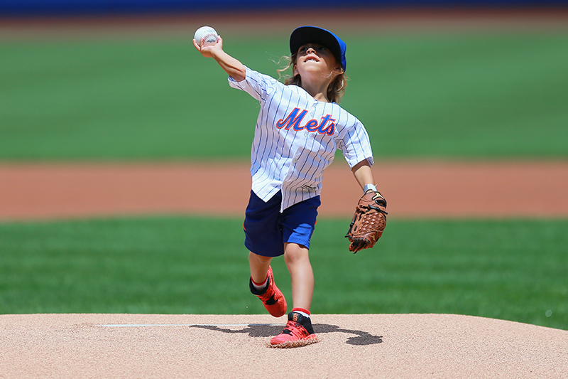 Ashtin "Mini Thor" Gerberg throws out the ceremonial first pitch before the baseball game between the Kansas City Royals and New York Mets at Citi Field in New York, Wednesday, June 22, 2016. (Gordon Donovan)