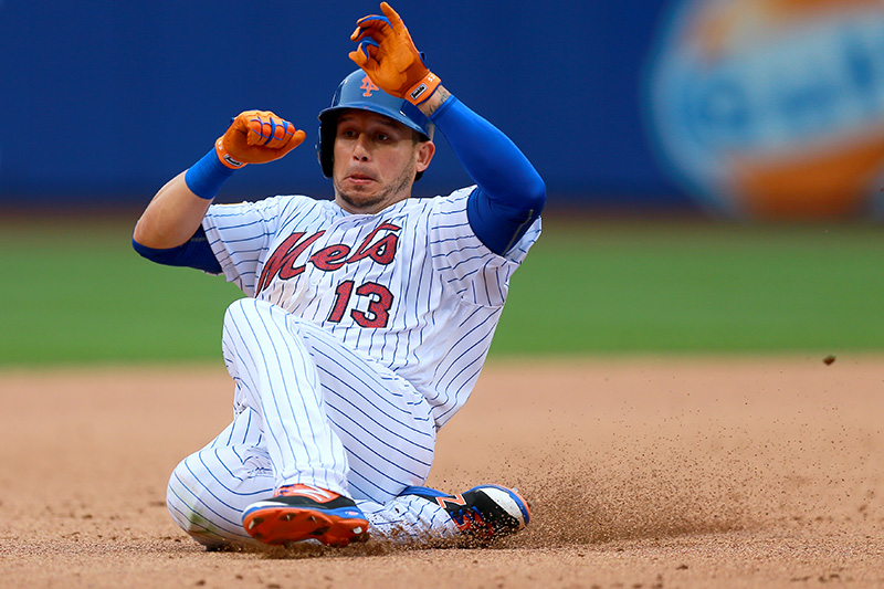 New York Mets Asdrubal Cabrera (13) slides into 3B in the sixth inning of a baseball game against the Miami Marlins at Citi Field in New York, Monday, July 4, 2016. (Gordon Donovan)