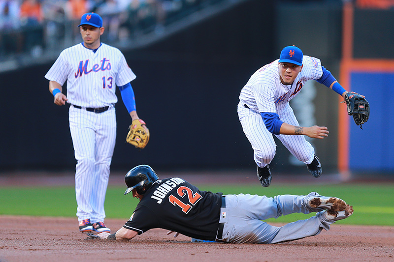 New York Mets 2nd baseman Wilmer Flores (4) fires a throw to 1st base in the second inning of a baseball game against the Miami Marlins at Citi Field in New York, Tuesday, July 5, 2016. (Gordon Donovan)