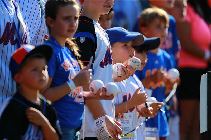 New York Mets fans look for autographs before the baseball game against the Arizona Diamondbacks at Citi Field in New York, Tuesday, Aug. 9, 2016. (Gordon Donovan)