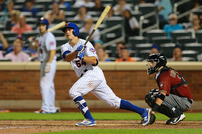 New York Mets T.J. Rivera (54) singles for his first big league hit in the tenth inning of a baseball game against the Arizona Diamondbacks at Citi Field in New York, Wednesday, Aug. 10, 2016. (Gordon Donovan)