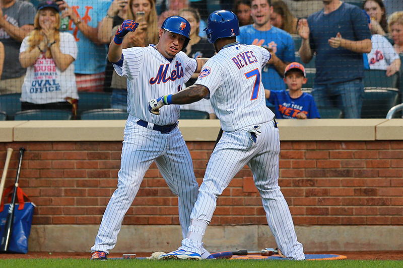 New York Mets Asdrubal Cabrera (13) and Jose Reyes (7) celebrate Reyes; home run in the first inning of a baseball game against the Philadelphia Phillies at Citi Field in New York, Friday, Aug. 26, 2016. (Gordon Donovan)