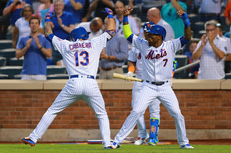 New York Mets Asdrubal Cabrera (13) and Jose Reyes (7) celebrate Cabrera's first inning home run against the Miami Marlins at Citi Field in New York, Tuesday, August 30, 2016. (Gordon Donovan)