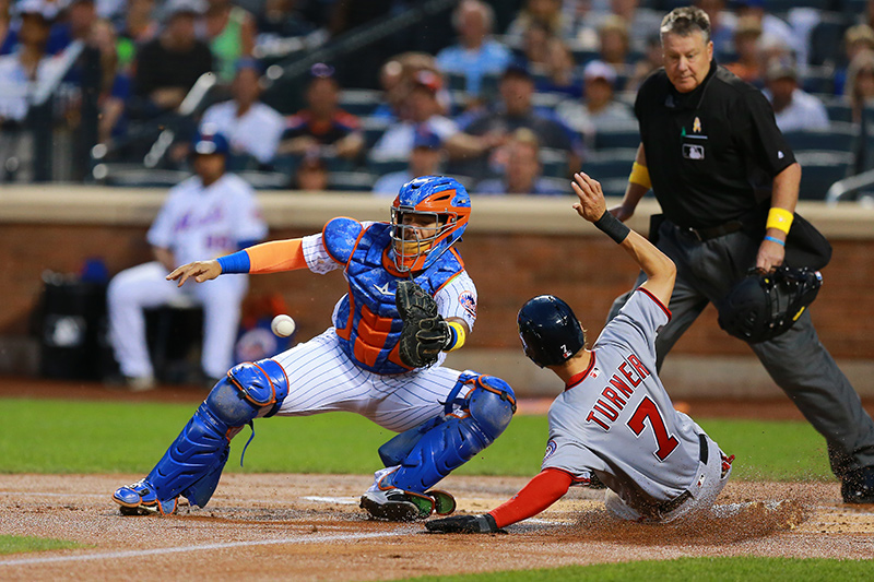 Washington Nationals Trea Turner (7) scores on a sacrifice fly by Bryce Harper in the first inning of a baseball game against the New York Mets at Citi Field in New York, Friday, Sept. 2, 2016. (Gordon Donovan)