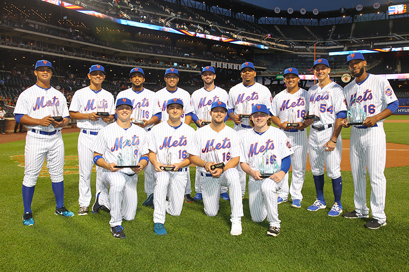 The New York Mets minor league players are honored with the 2016 Sterling Equities Awards,from left to right, top; Raul Beracierta, Andres Gimenez, Carlos Sanchez, Desmond Lindsay, Tomas Nido, Dominic Smith, Phillip Evans, T.J. Rivera, Amed Rosario. From left to right, bottom; Brandon Nimmo, Thomas Szapucki, David Thompson, P.J. Conlon, before the baseball game on Sept. 19, 2016. (Gordon Donovan)