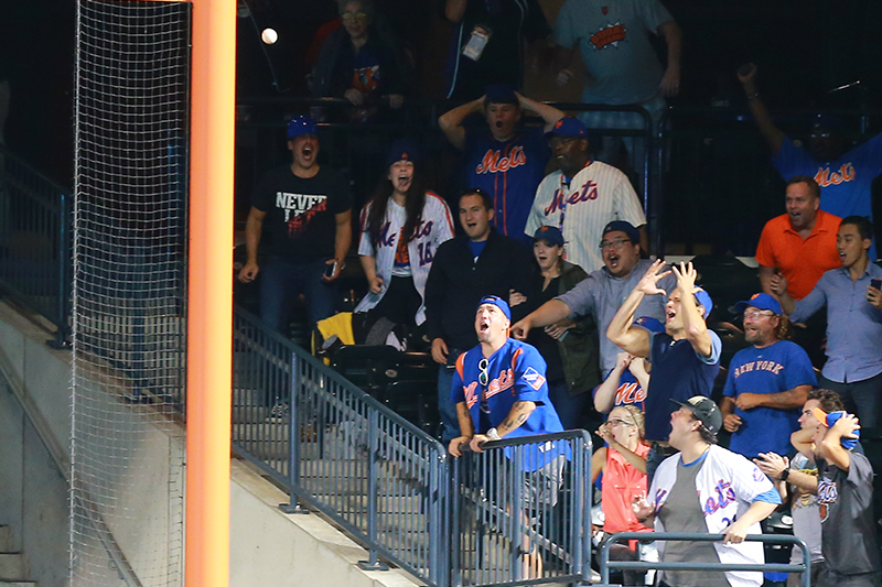 New York Met fans react as Lucas Duda's deep drive to right field hooks foul in the tenth inning of a baseball game against the Philadelphia Phillies at Citi Field in New York, Thursday, Sept. 22, 2016. (Gordon Donovan)