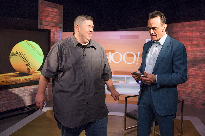 Yahoo MLB columnist Mike Oz of Big League Stew opens packs of 1992 Topps baseball cards with actor Hank Azaria during an interview at the Yahoo Studios in New York City on April 5, 2017. (Gordon Donovan/Yahoo News)