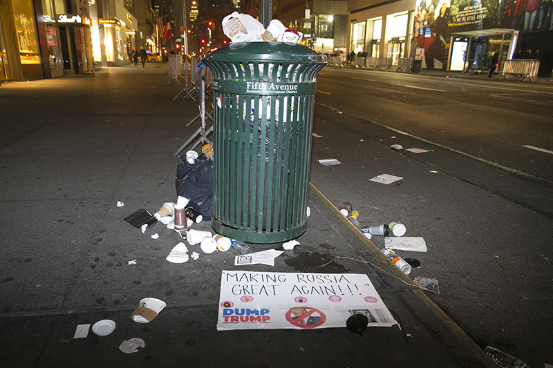 Discarded sign lies near a trash can from the Women's March in New York City on Jan. 21, 2017. (Gordon Donovan/Yahoo News)