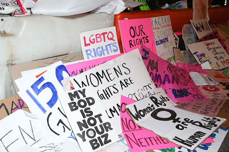 Discarded signs from Women's March lie on streets around the corner from Trump Tower in New York City on Jan. 21, 2017. (Gordon Donovan/Yahoo News)