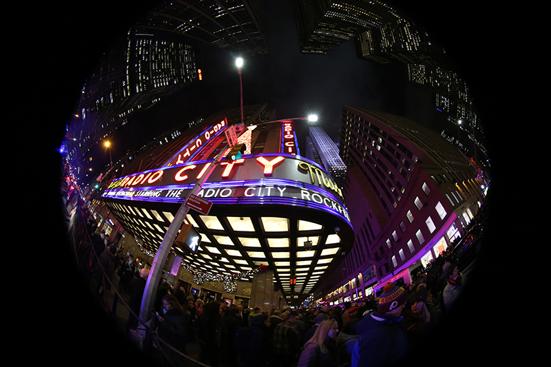Large crowds fill the sidewalks outside Radio City Music Hall in New York City for the annual Christmas shows, and shopping. Photo taken with a fish eye lens. (Gordon Donovan/Yahoo News)