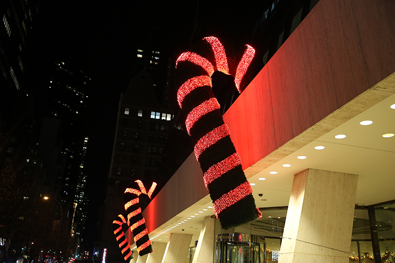 Giant candy canes hang outside an office building on W. 57th St. in New York City. (Gordon Donovan/Yahoo News)